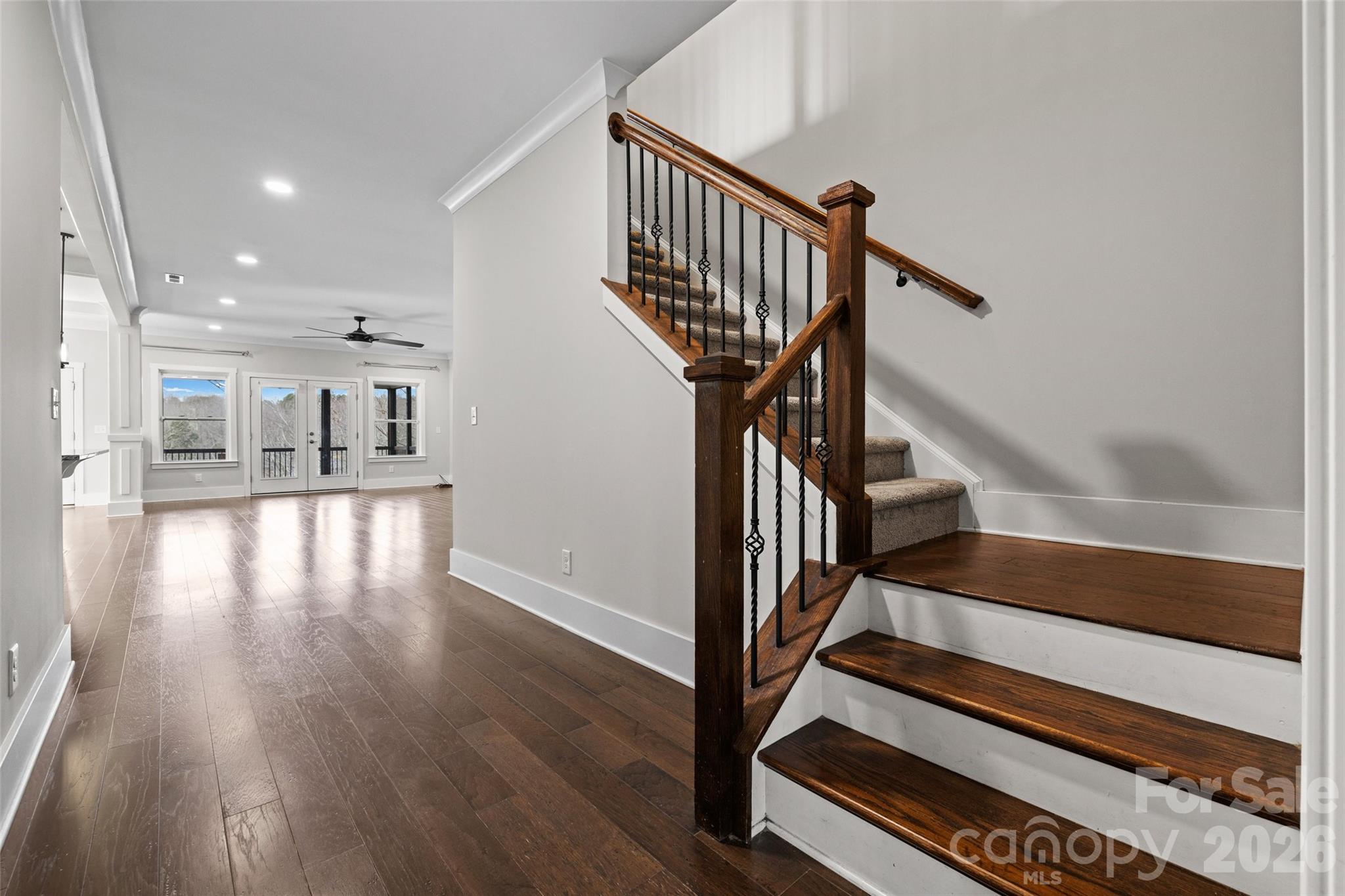 12039 Spinnaker Drive Tega Cay, SC 29708 - Photo 18 of 48 a view of entryway and hall with wooden floor
