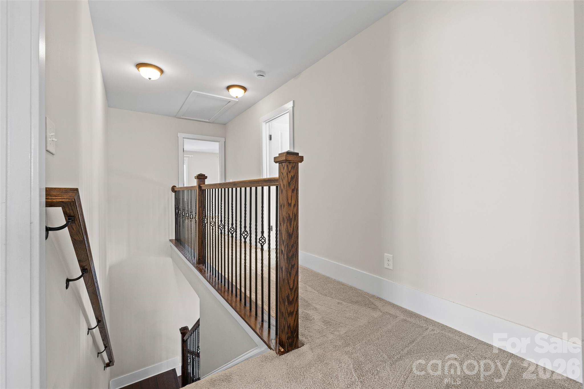 12039 Spinnaker Drive Tega Cay, SC 29708 - Photo 19 of 48 a view of a hallway with staircase
