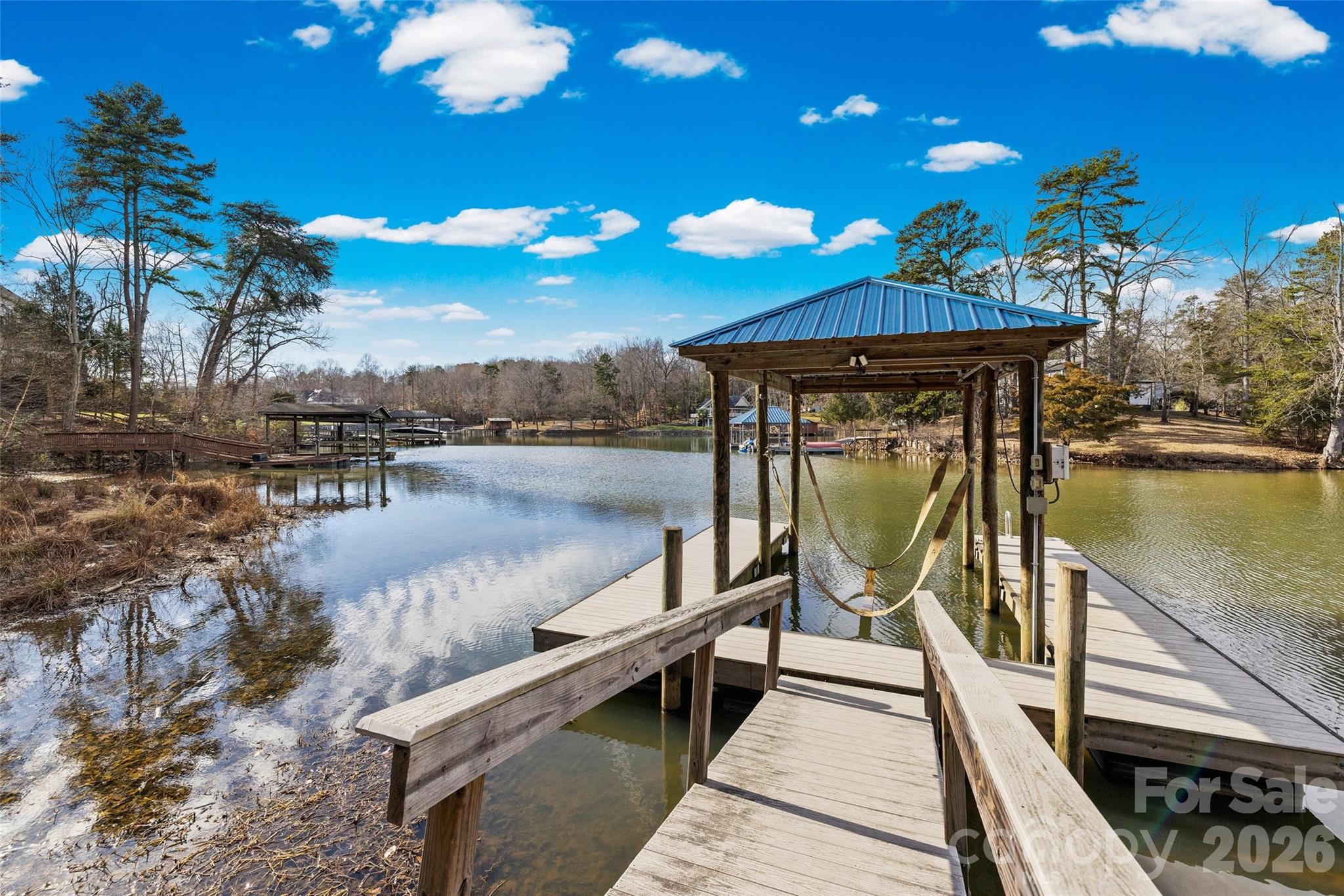 12039 Spinnaker Drive Tega Cay, SC 29708 - Photo 2 of 48 a view of a balcony with chairs