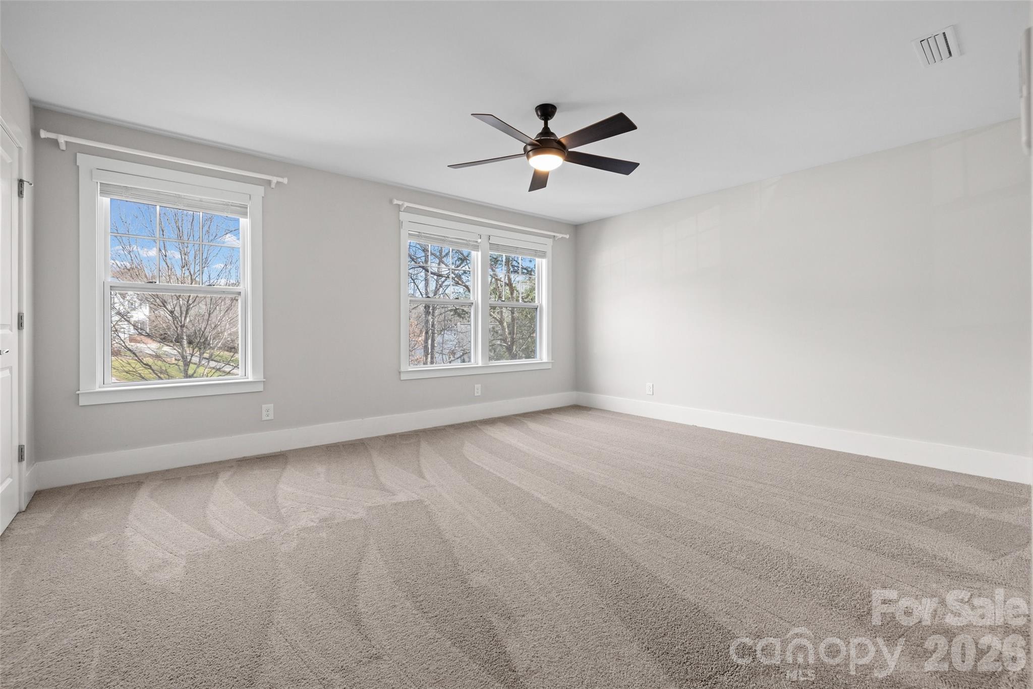 12039 Spinnaker Drive Tega Cay, SC 29708 - Photo 23 of 48 a view of an empty room with a window