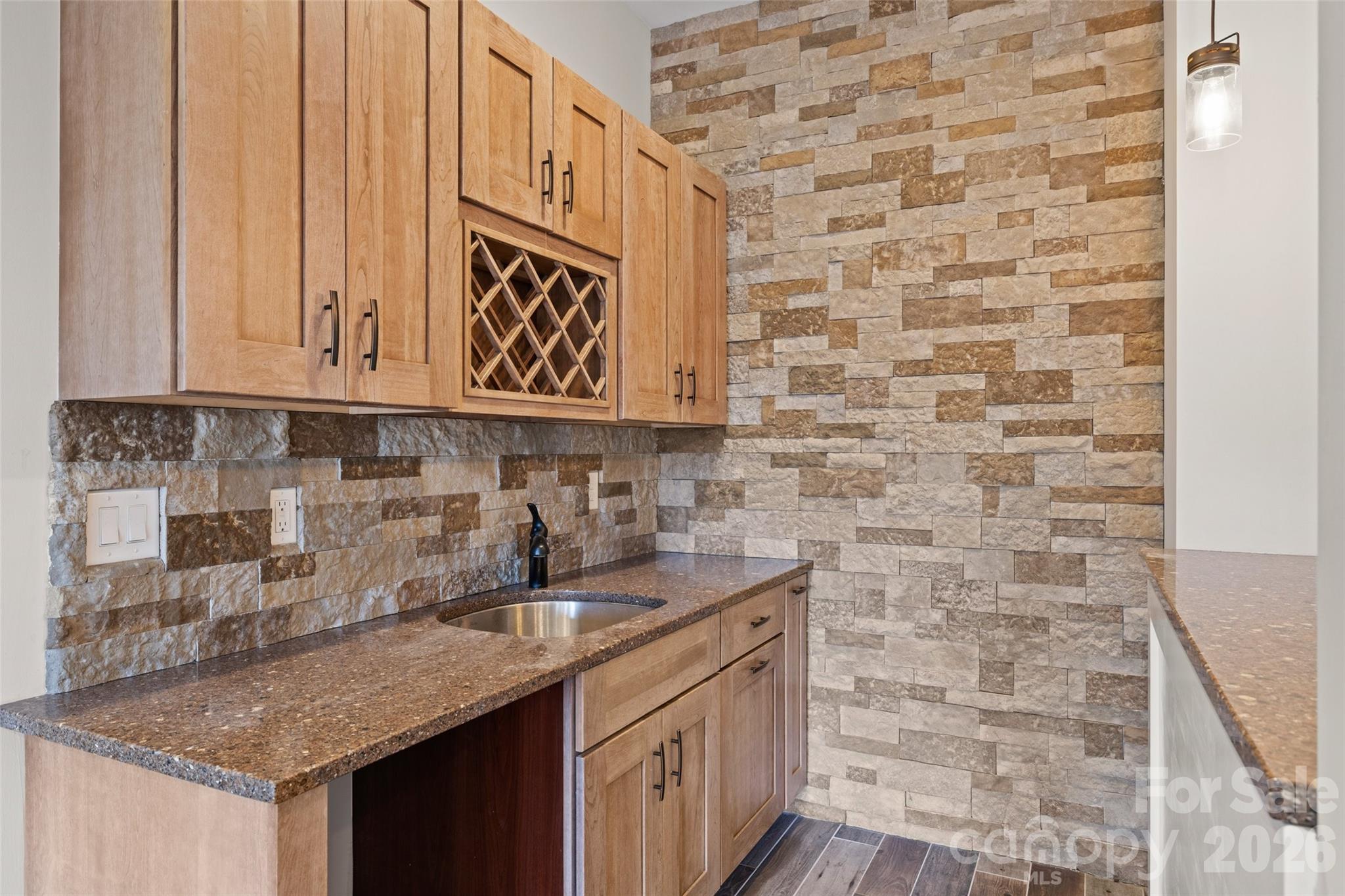 12039 Spinnaker Drive Tega Cay, SC 29708 - Photo 30 of 48 a kitchen with stainless steel appliances granite countertop a sink stove and cabinets