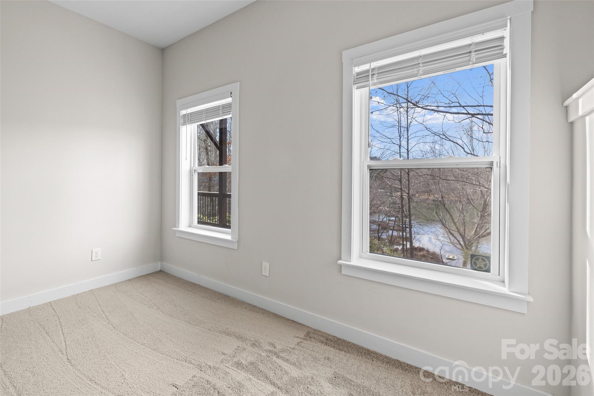 12039 Spinnaker Drive Tega Cay, SC 29708 - Photo 34 of 48 a view of an empty room with a window