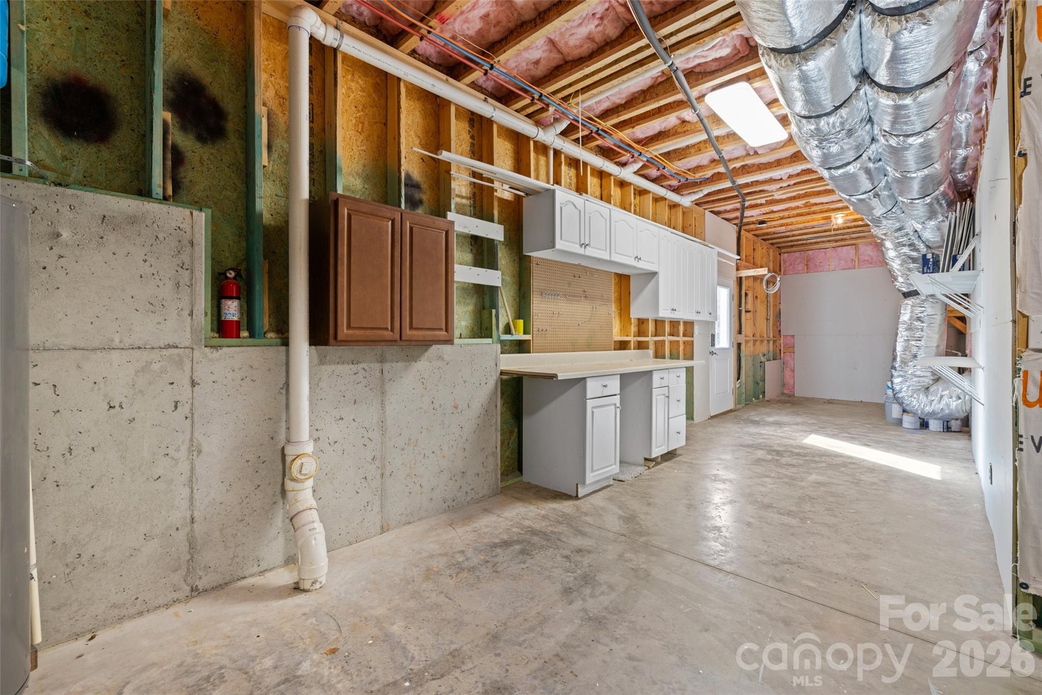 12039 Spinnaker Drive Tega Cay, SC 29708 - Photo 38 of 48 a view of a kitchen with a sink and cabinets