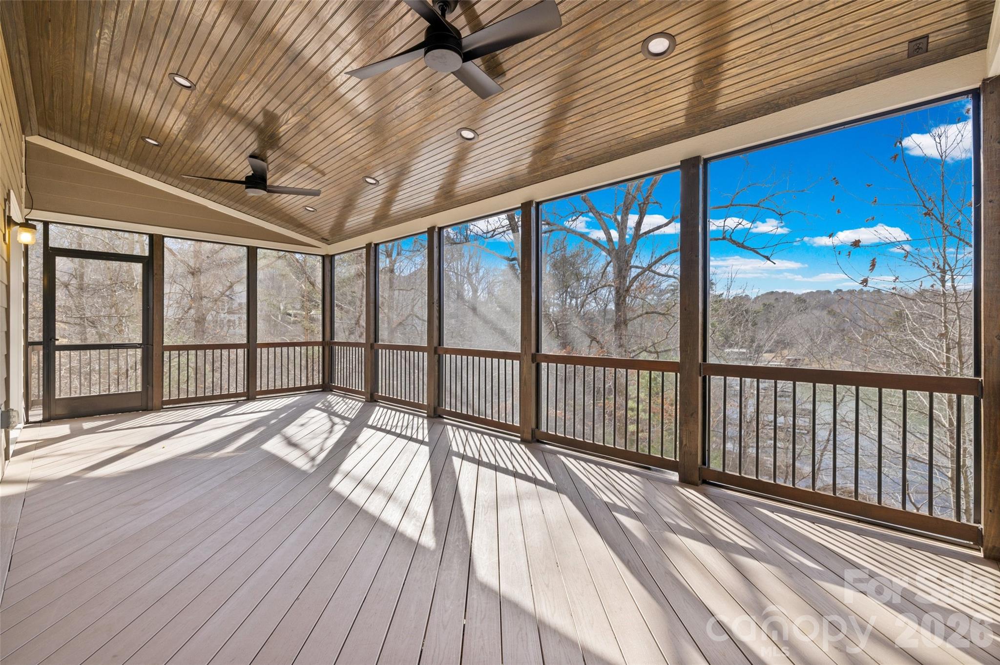 12039 Spinnaker Drive Tega Cay, SC 29708 - Photo 40 of 48 a view of a balcony with wooden floor