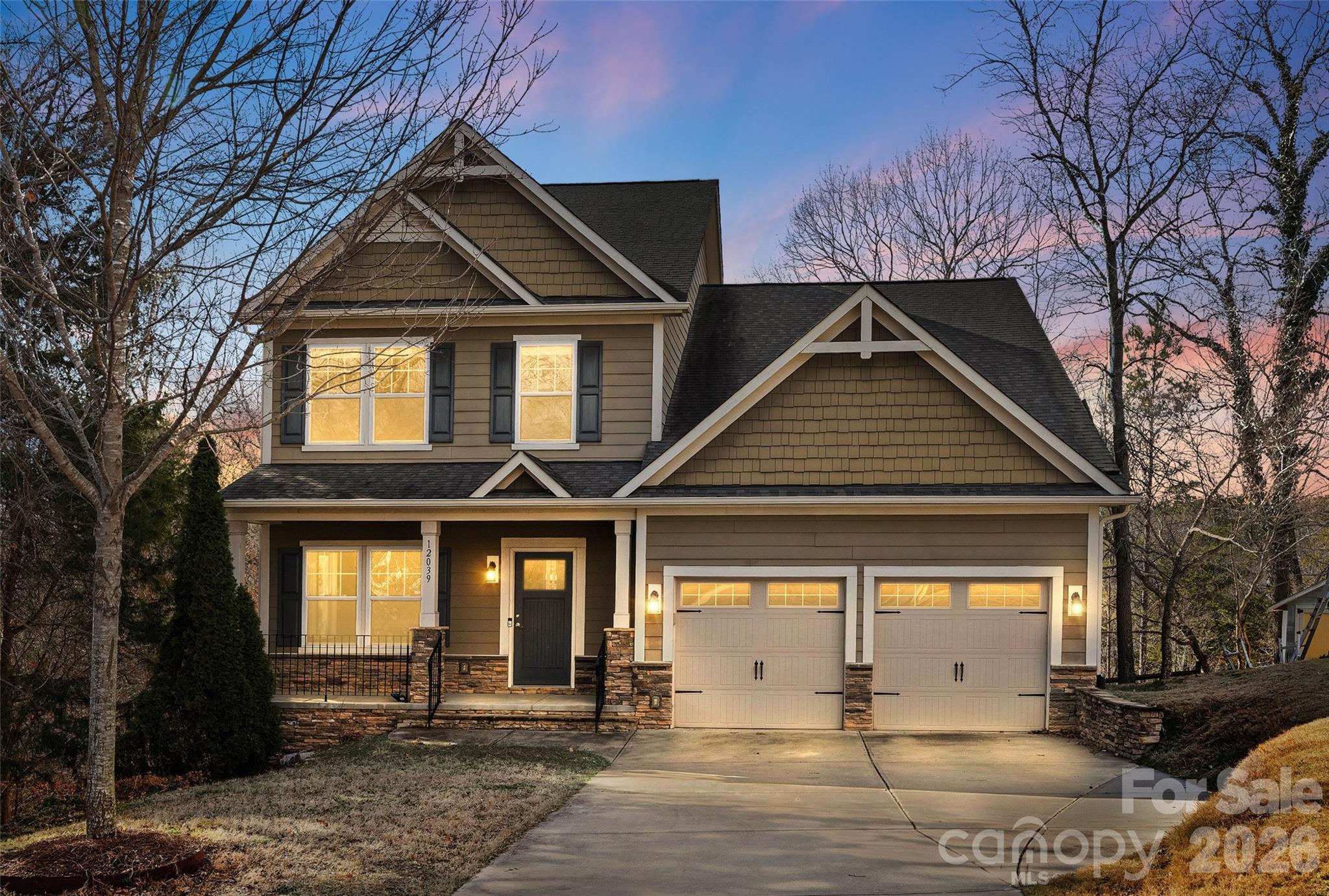 12039 Spinnaker Drive Tega Cay, SC 29708 - Photo 4 of 48 a front view of a house with a yard