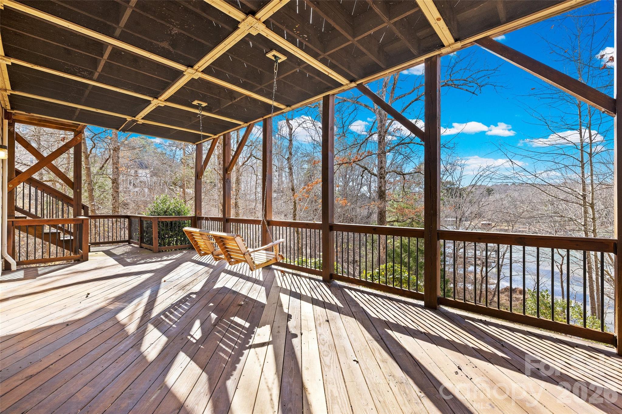 12039 Spinnaker Drive Tega Cay, SC 29708 - Photo 46 of 48 a view of a balcony with wooden floor
