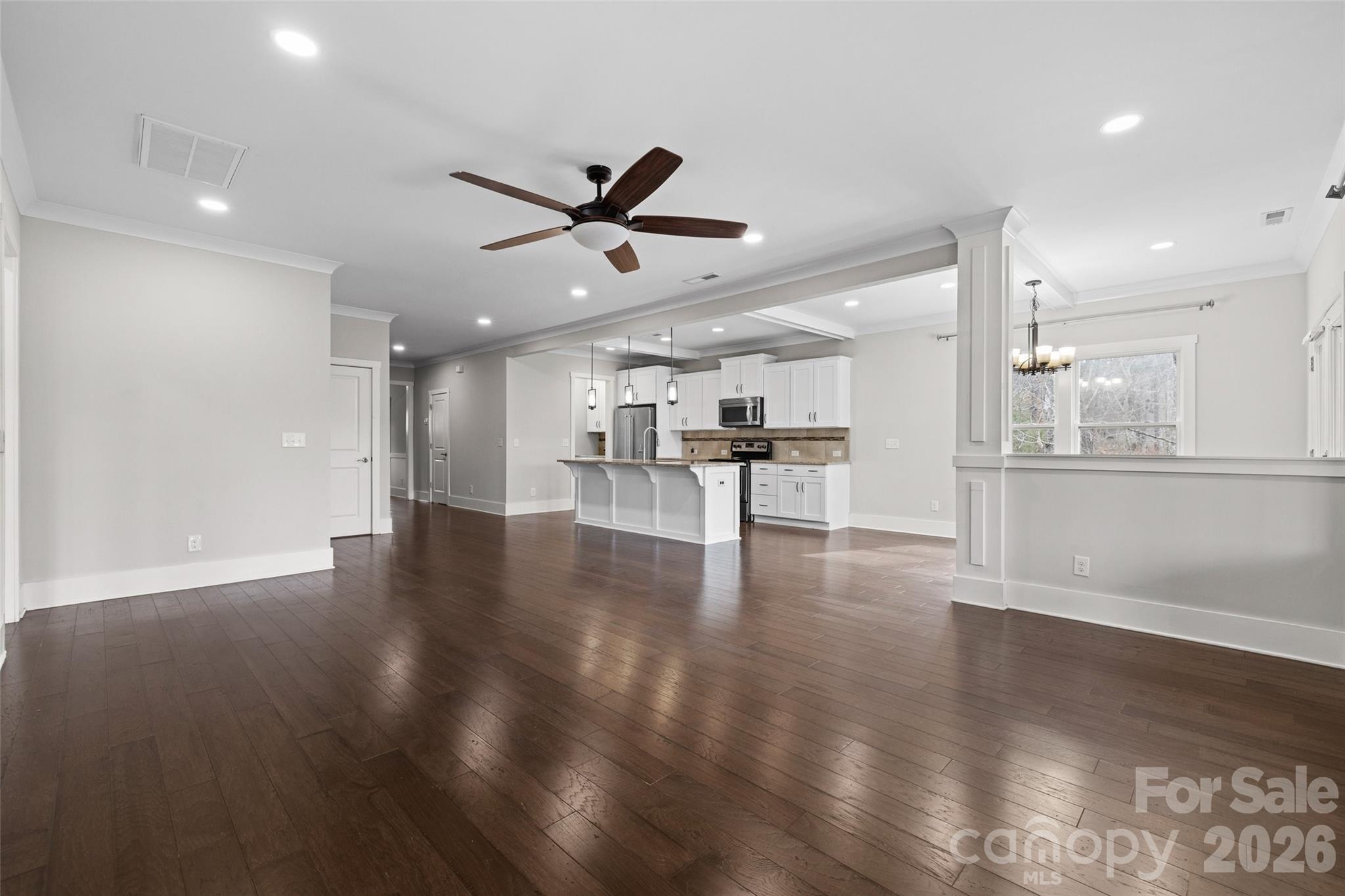 12039 Spinnaker Drive Tega Cay, SC 29708 - Photo 7 of 48 a view of a kitchen with a sink and a stove top oven