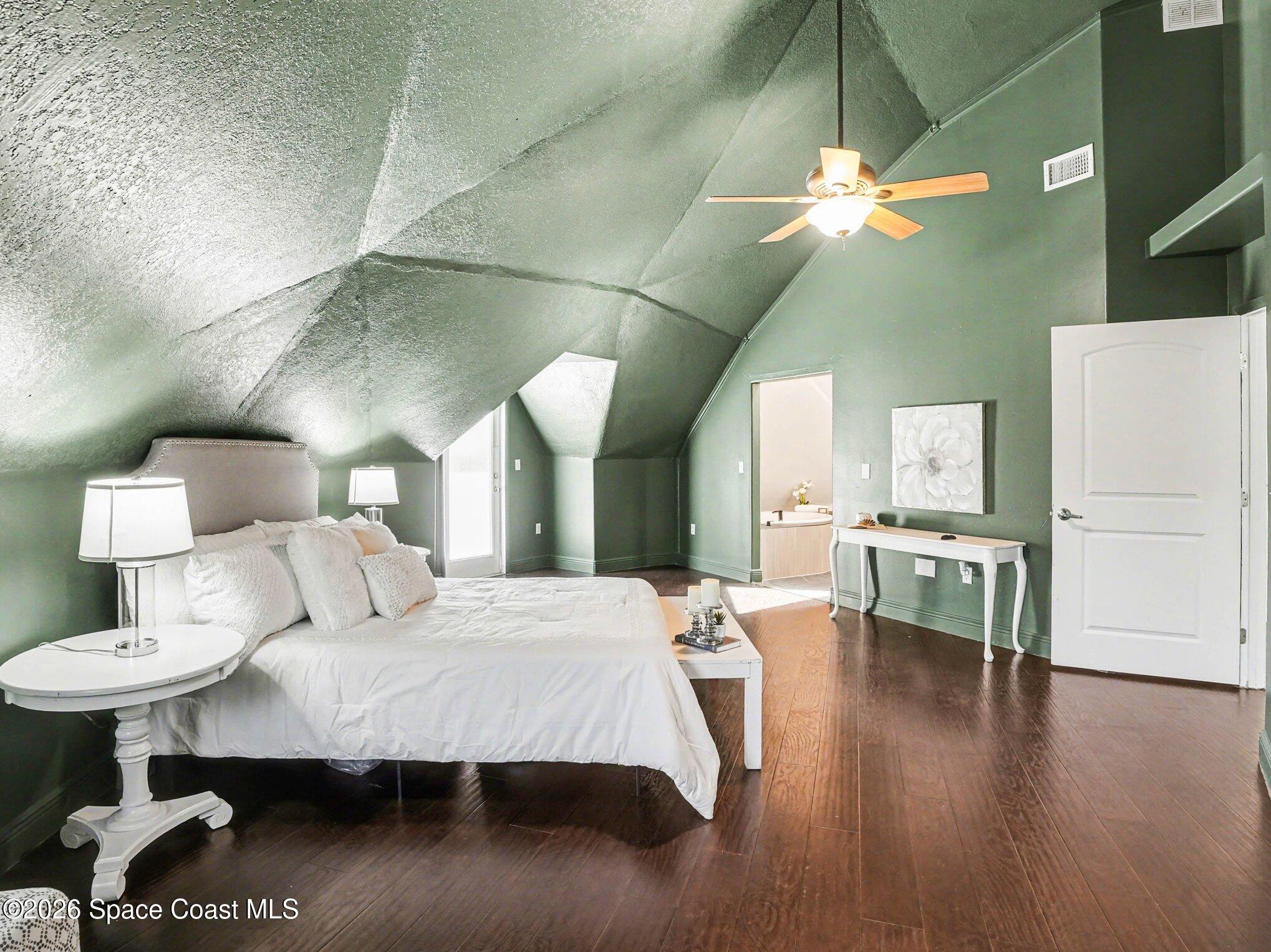 4045 Jake Avenue Cocoa, FL 32926 - Photo 23 of 35 a bedroom with a bed and a table