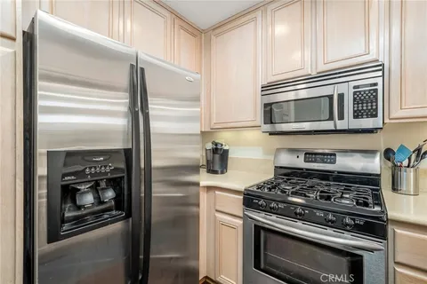 a kitchen with a stove microwave and refrigerator