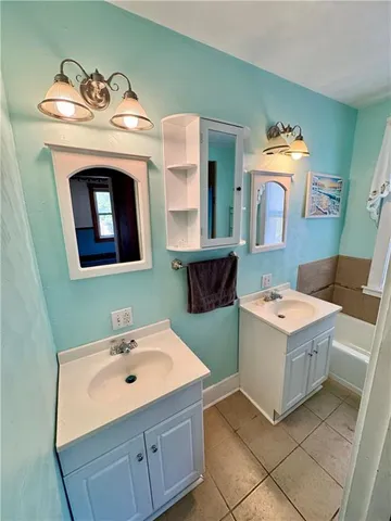 a bathroom with a sink and mirror