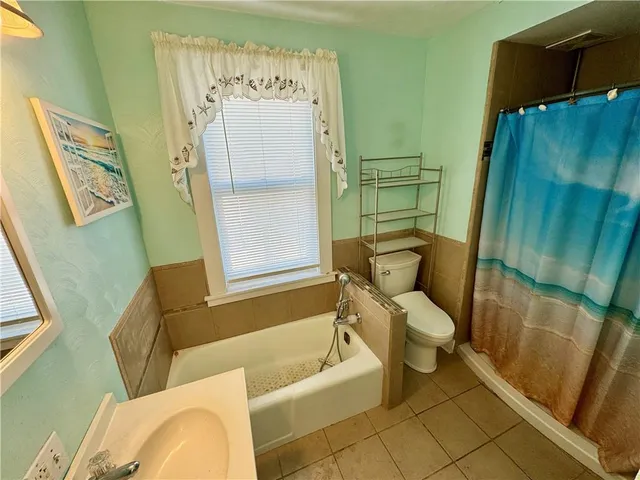 a bathroom with a sink and toilet