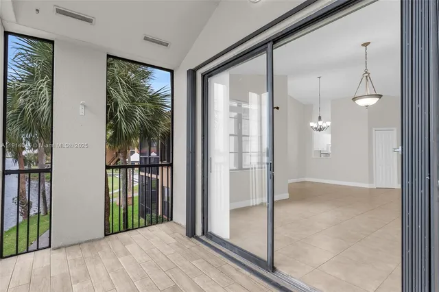 a view of a bathroom with a glass door