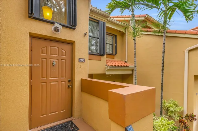 a bathroom with a sink a mirror and a shower curtain