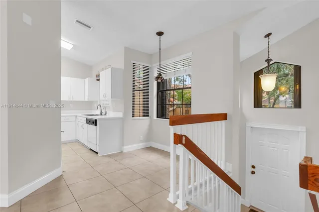 a view of a hallway with windows