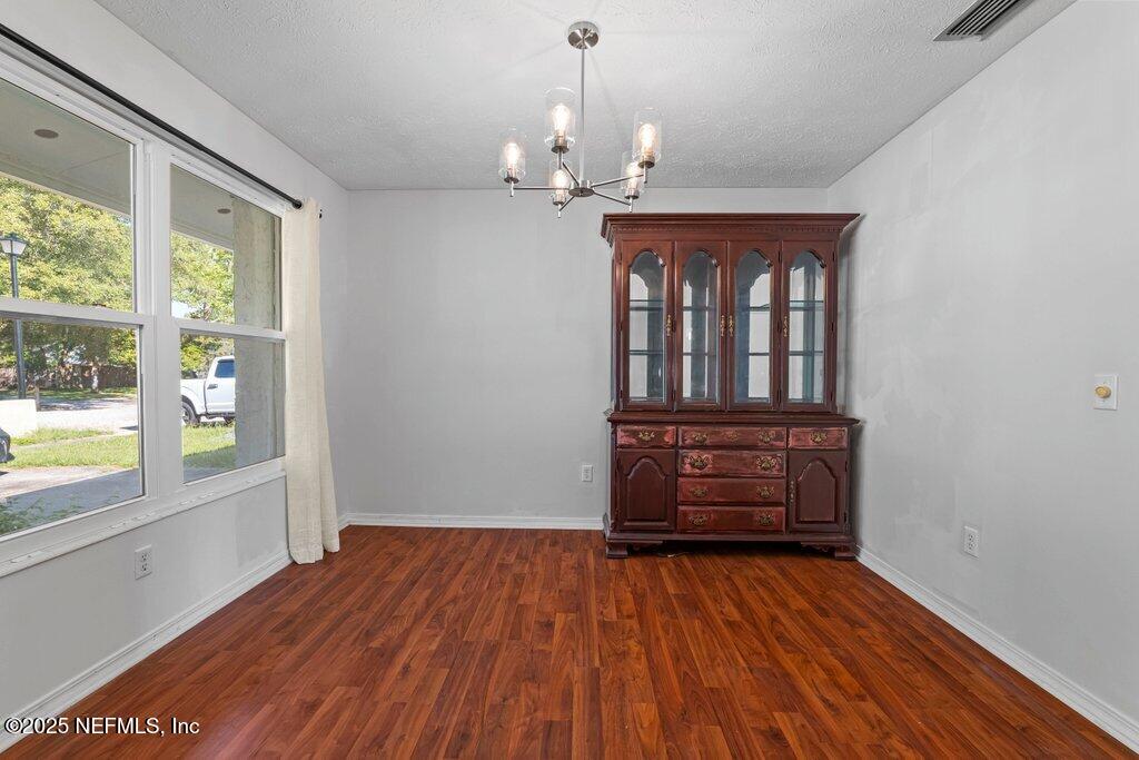 11631 East Ride Drive Jacksonville, FL 32223 - Photo 19 of 28 wooden floor in an empty room with a window