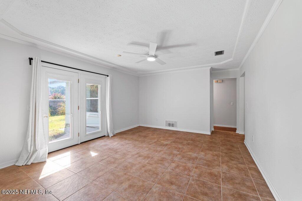 11631 East Ride Drive Jacksonville, FL 32223 - Photo 4 of 28 a view of an empty room with a window