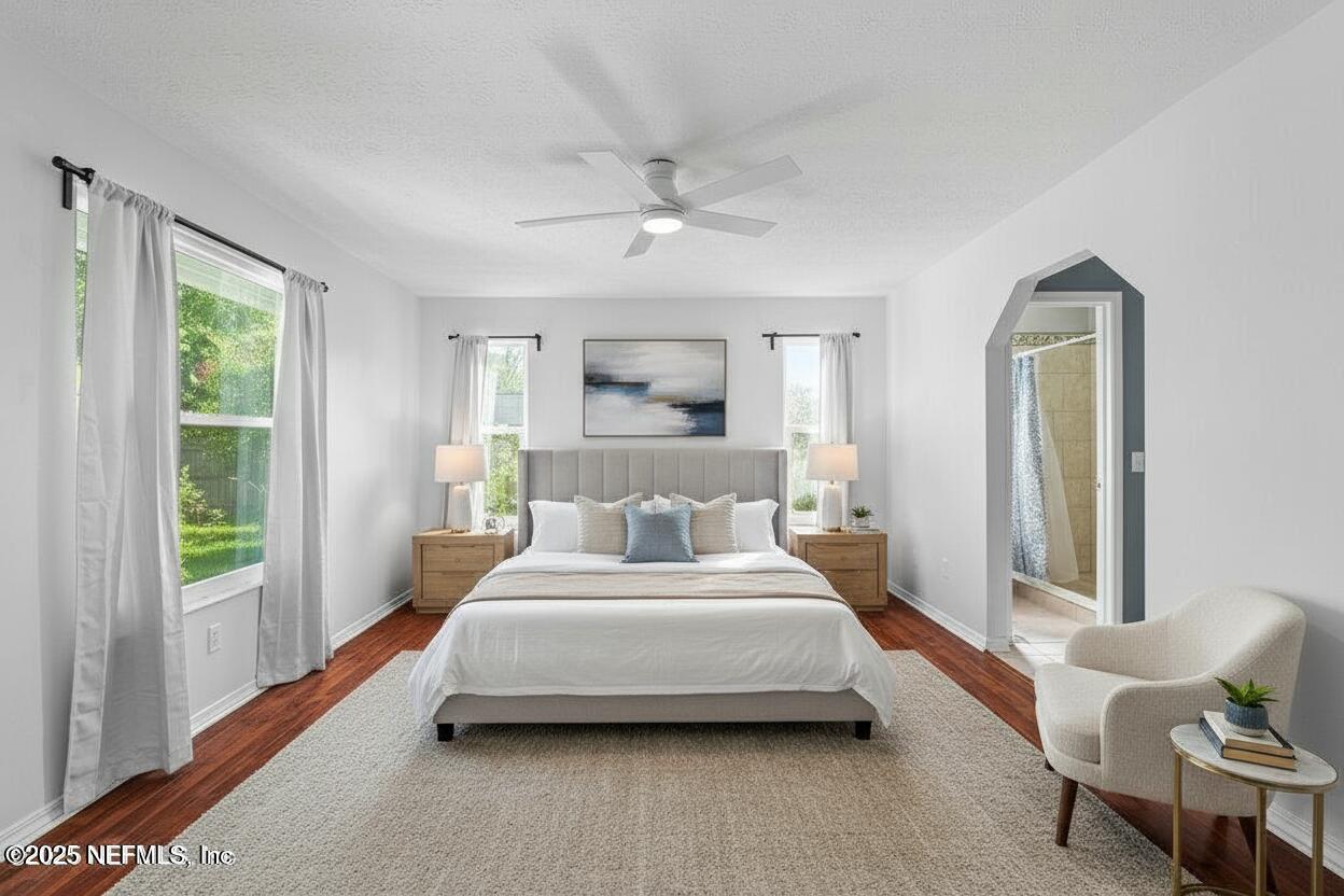 11631 East Ride Drive Jacksonville, FL 32223 - Photo 5 of 28 a bedroom with a bed couch and window