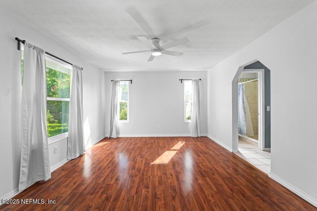 11631 East Ride Drive Jacksonville, FL 32223 - Photo 6 of 28 wooden floor in an empty room with a window