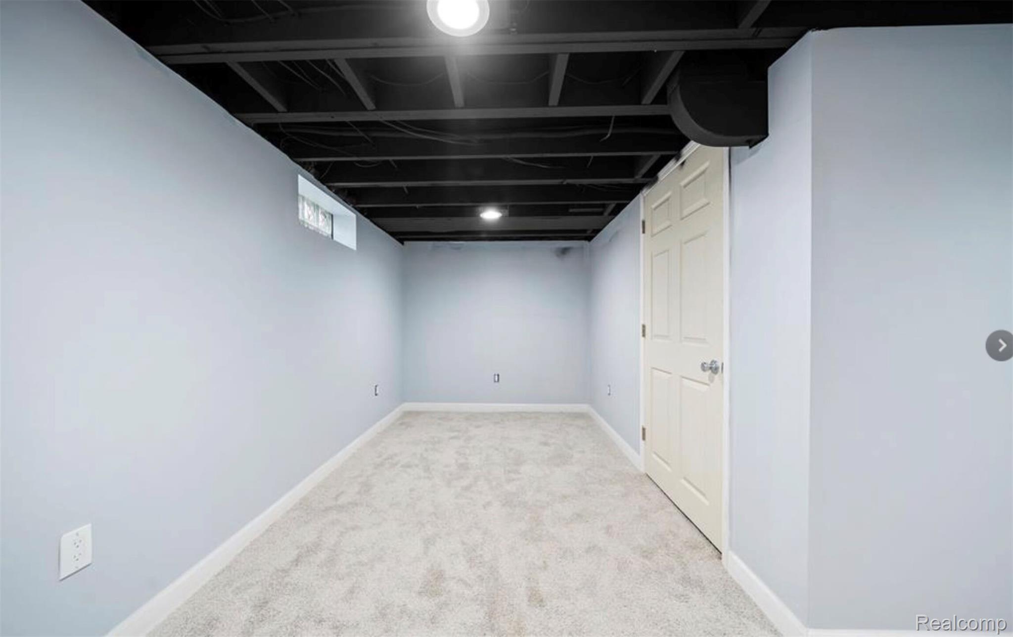 4214 Berkshire Road Royal Oak, MI 48073 - Photo 21 of 27 Finished lower level offering light gray walls, white trim, gray carpet flooring, and recessed lighting