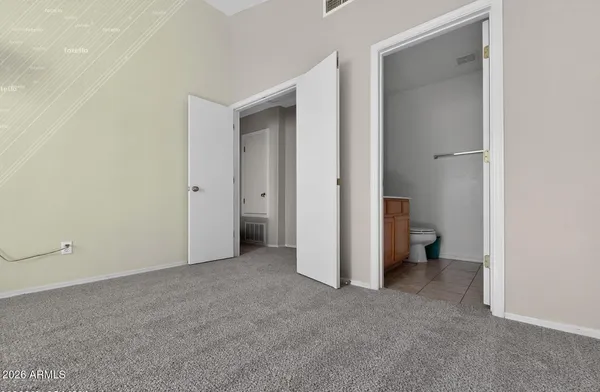 a view of a room with a hallway and a room