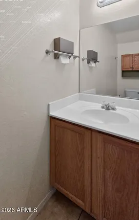 a bathroom with a sink and vanity