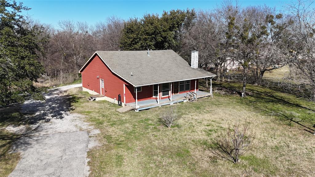 147 Stacks Road Ennis, TX 75119 - Photo 1 of 1 a view of a house with a yard and large tree