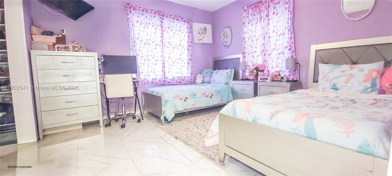 232 Northeast 160th Street Miami, FL 33162 - Photo 12 of 36 a bedroom with a bed and a dresser