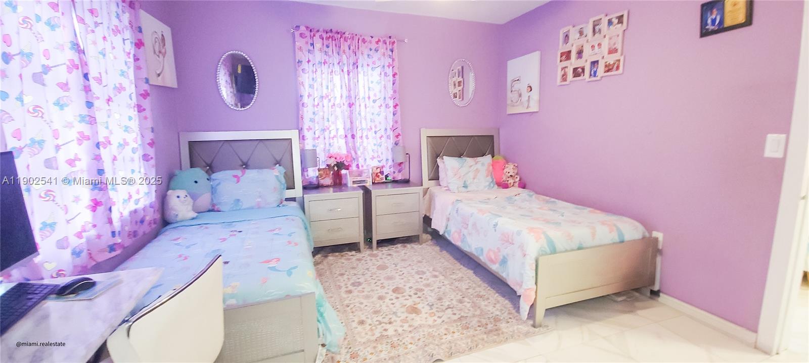 232 Northeast 160th Street Miami, FL 33162 - Photo 14 of 36 a bed room with a bed and a couch