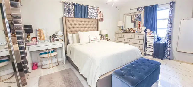 a bed room with a bed and a cabinets