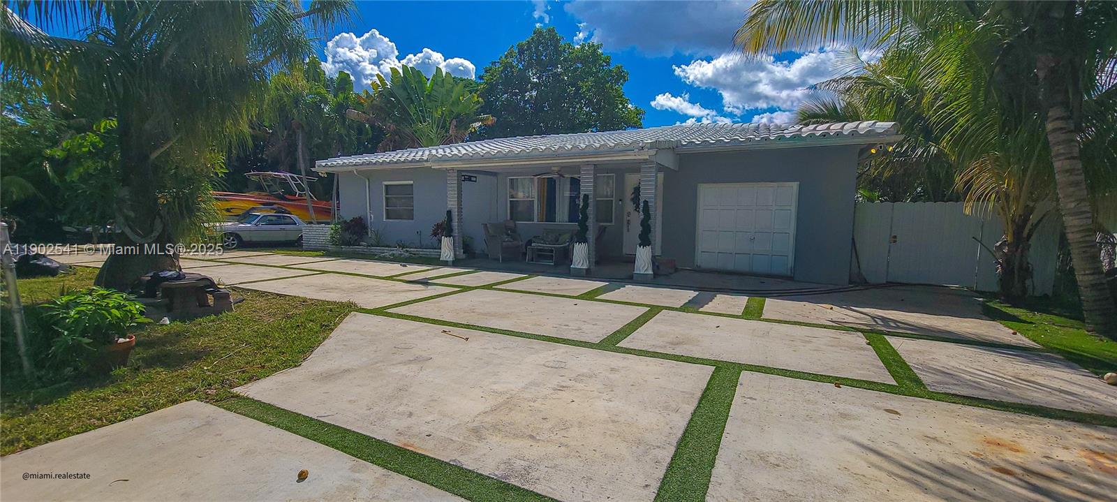 232 Northeast 160th Street Miami, FL 33162 - Photo 2 of 36 a house with yard in front of it