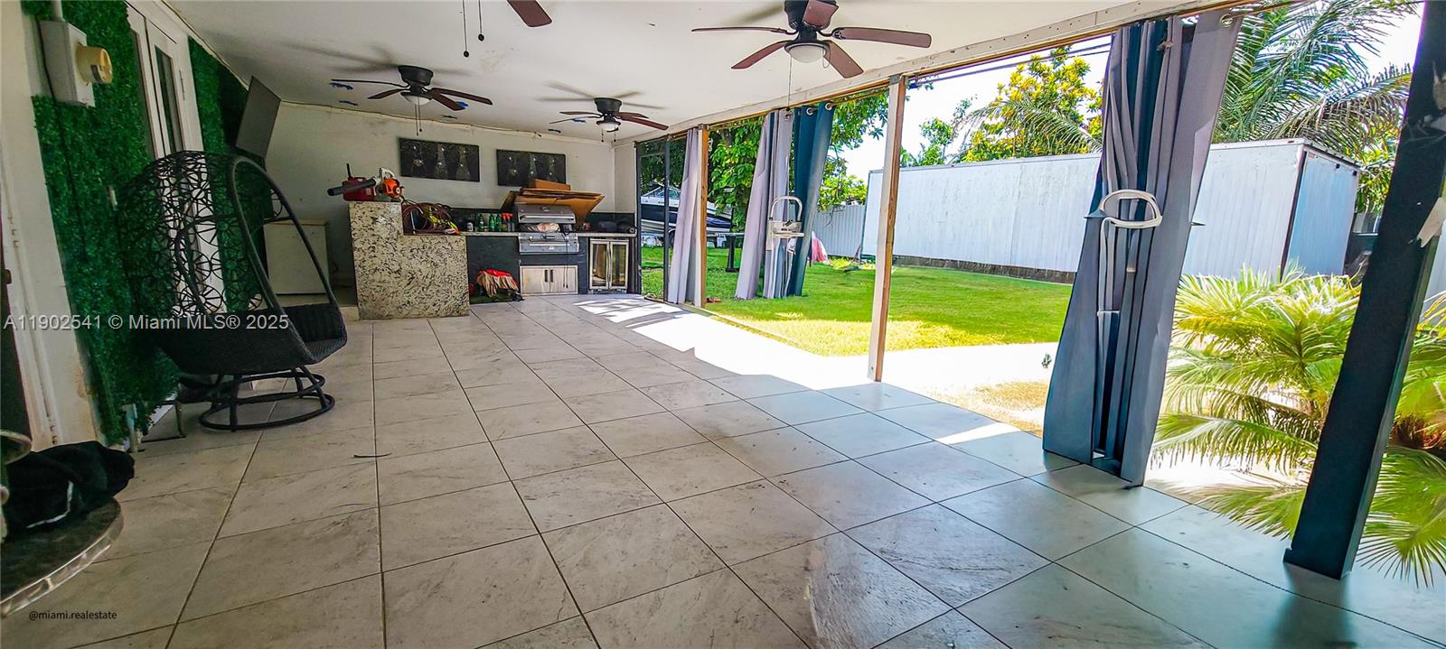 232 Northeast 160th Street Miami, FL 33162 - Photo 25 of 36 a view of a living room and balcony