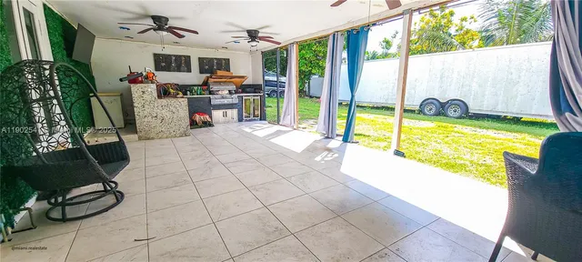 a view of swimming pool with seating area
