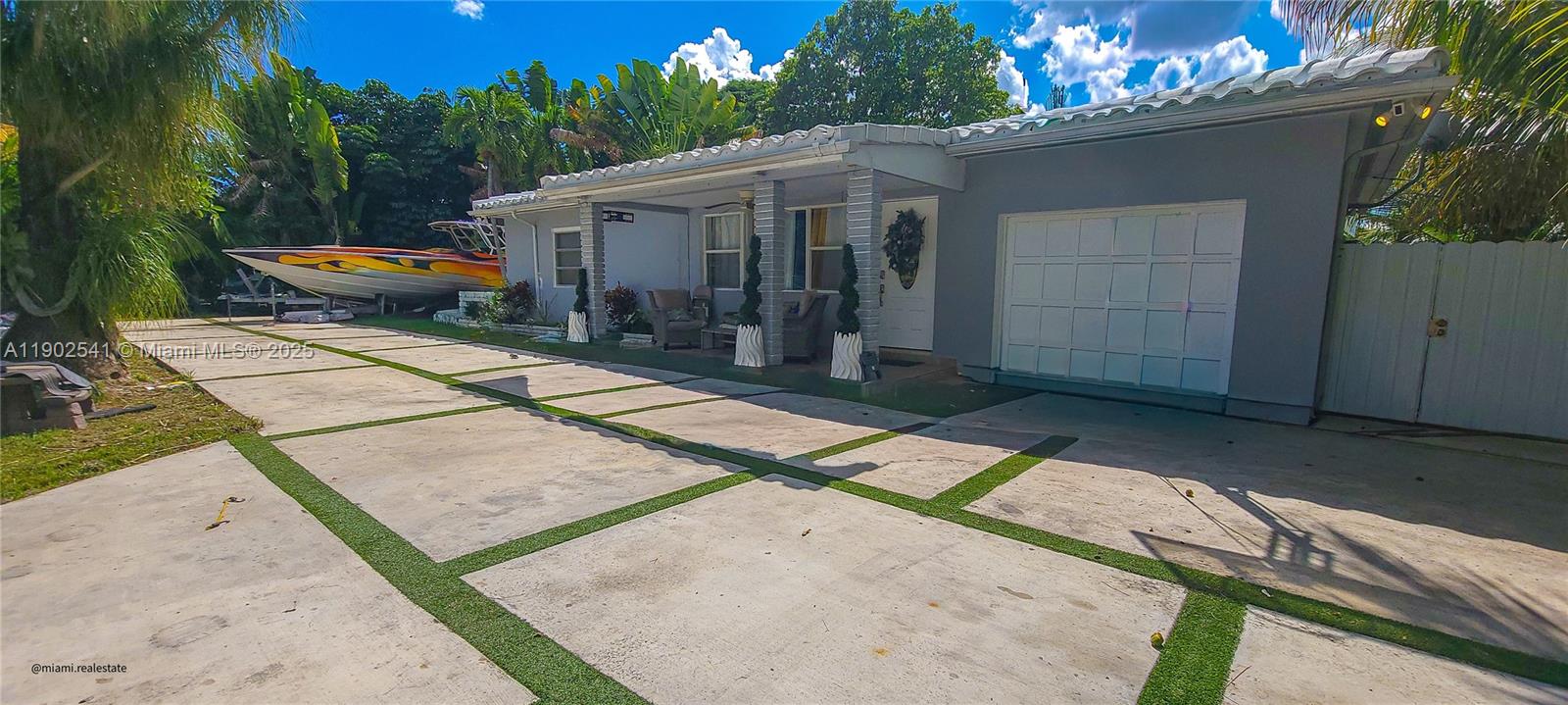 232 Northeast 160th Street Miami, FL 33162 - Photo 4 of 36 a house with sign broad