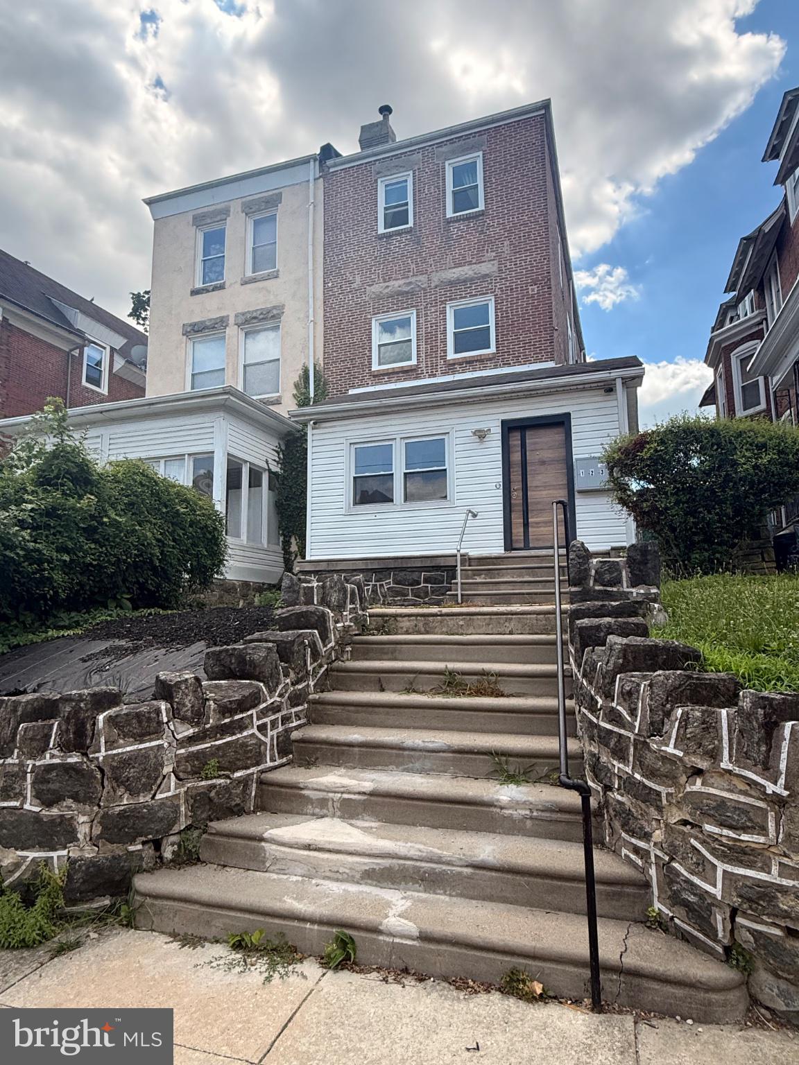 822 Wynnewood Road, Unit 1 Philadelphia, PA 19151 - Photo 1 of 16 a front view of a house with a garden