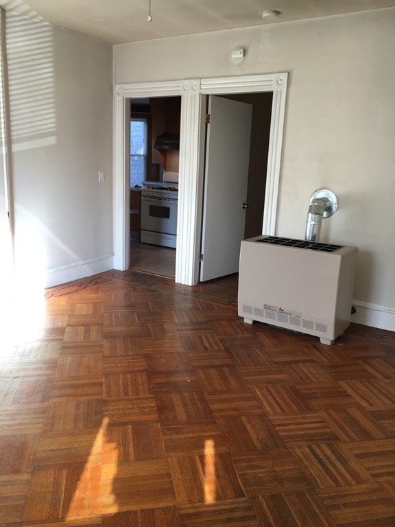 682 2nd Street Fall River, MA 02721 - Photo 5 of 12 a view of hallway with wooden floor