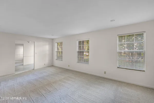 a view of an empty room with a window