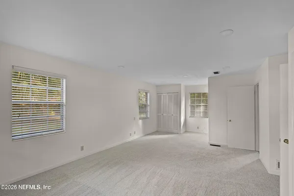 a view of empty room with windows
