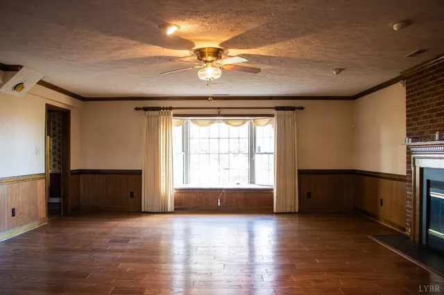 a stove top oven sitting inside of a kitchen