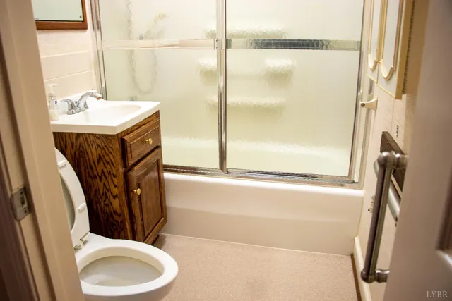 a view of a house with a yard and garage