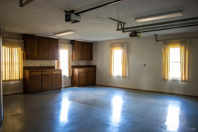 a view of a house with pool and ocean view