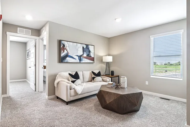 a living room with furniture and a window