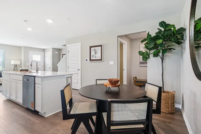 a view of a dining room with furniture and window