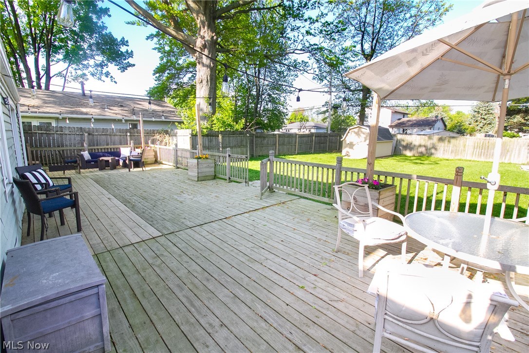 4796 Forest Road Mentor, OH 44060 - Photo 25 of 34 Deck with a yard and a storage unit