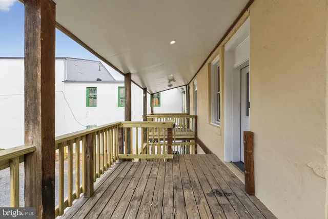 a view of a balcony with chairs