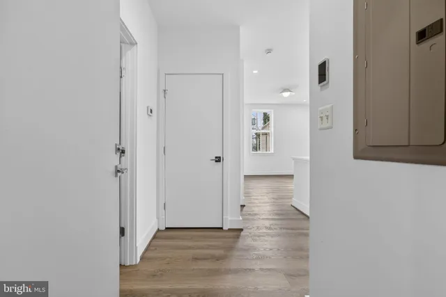 wooden floor with white walls