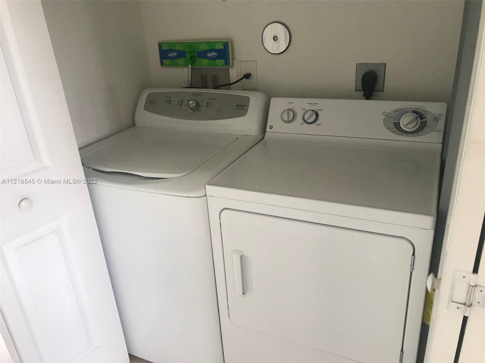 Malibu Bay Homestead, FL 33033 - Photo 12 of 12 a utility room with dryer and washer