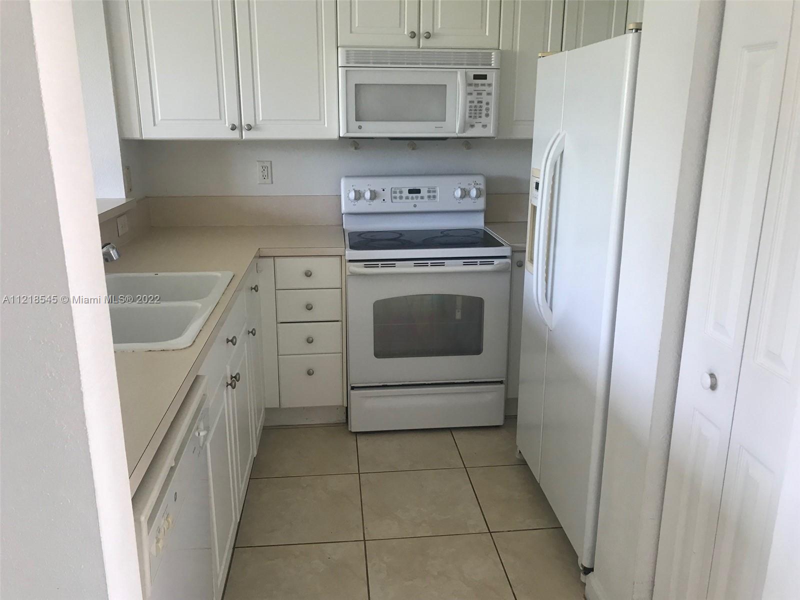 Malibu Bay Homestead, FL 33033 - Photo 6 of 12 a kitchen with stainless steel appliances a refrigerator and a stove