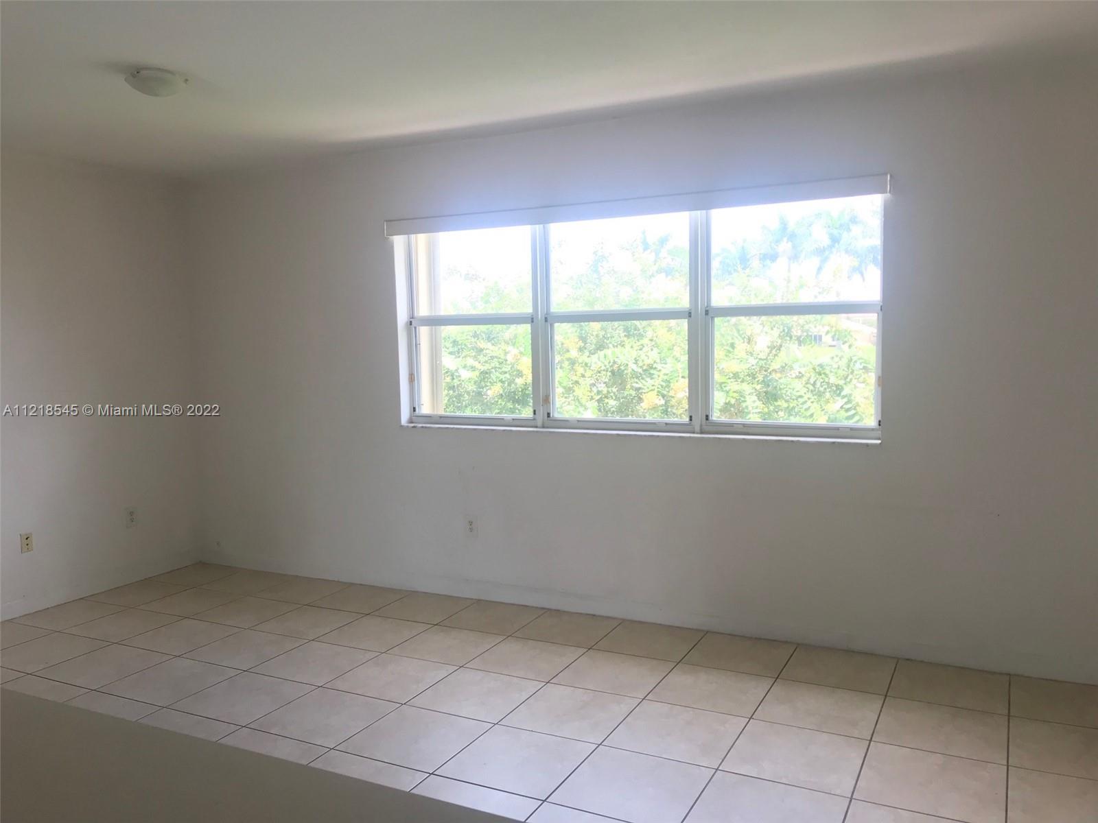 Malibu Bay Homestead, FL 33033 - Photo 8 of 12 an empty room with a window