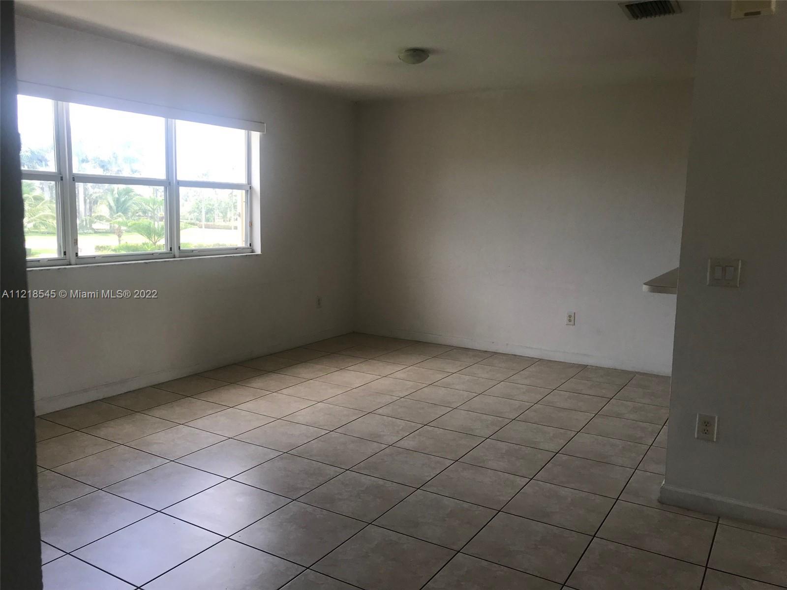 Malibu Bay Homestead, FL 33033 - Photo 9 of 12 an empty room with windows