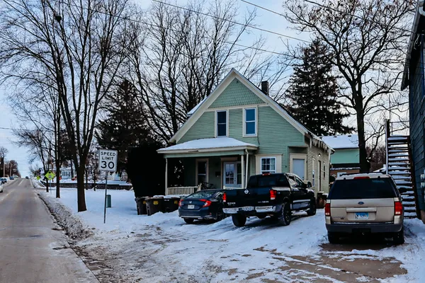 a view of a car parked in front of house